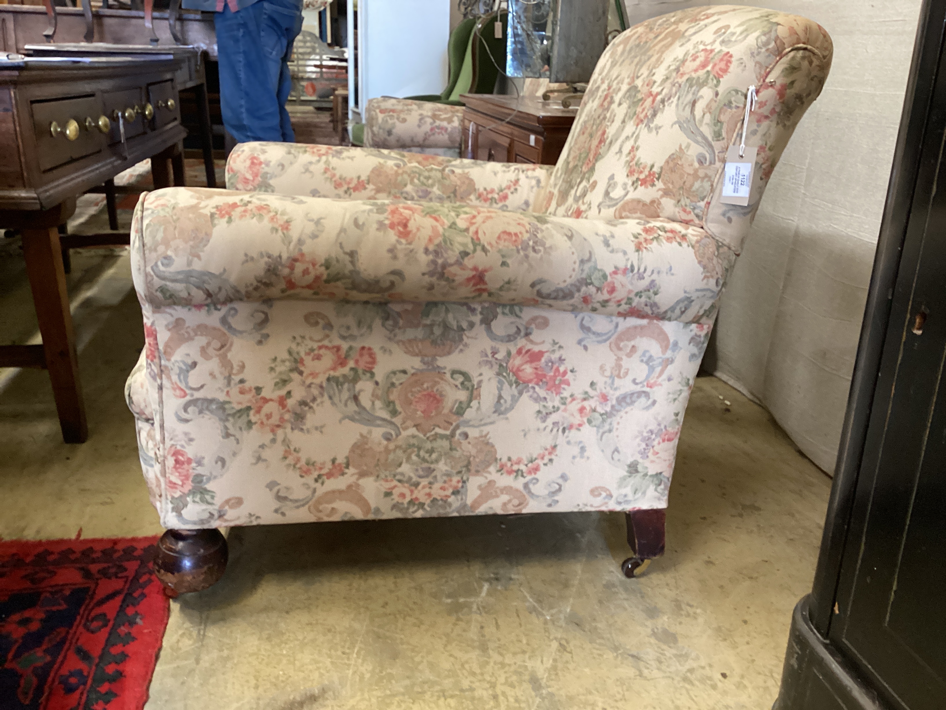 A pair of early 20th century upholstered armchairs, width 82cm, depth 86cm, height 76cm